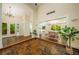 Foyer with unique brick floor, chandelier, and views into the dining room and front yard at 1690 Trotters Ln, Stone Mountain, GA 30087