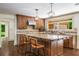 Stylish kitchen with custom cabinetry, granite countertops, and a central island with bar seating at 1690 Trotters Ln, Stone Mountain, GA 30087