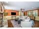 Inviting living room with hardwood floors, stone fireplace, and elegant furnishings at 1690 Trotters Ln, Stone Mountain, GA 30087