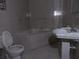 Bathroom with built-in tub and ceramic tile needs renovations at 2447 Omaha Sw Rd, Atlanta, GA 30331