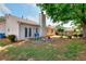 Lush backyard featuring a patio, trees, and a fence at 2465 Planters Cove Cir, Lawrenceville, GA 30044