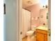 Small bathroom featuring a toilet, vanity, and tiled floor at 2465 Planters Cove Cir, Lawrenceville, GA 30044