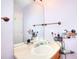 Standard bathroom with a single sink vanity, mirror, and storage at 2465 Planters Cove Cir, Lawrenceville, GA 30044