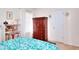 Comfortable bedroom with a dresser, a bookshelf, and natural light at 2465 Planters Cove Cir, Lawrenceville, GA 30044