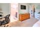 Cozy bedroom with wood dresser, tv, and ensuite bathroom at 2465 Planters Cove Cir, Lawrenceville, GA 30044