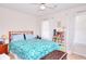 Inviting bedroom featuring a floral comforter, natural light, and comfortable furnishings at 2465 Planters Cove Cir, Lawrenceville, GA 30044