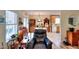 Bright living room with hardwood floors, a large window, and an adjacent dining area at 2465 Planters Cove Cir, Lawrenceville, GA 30044