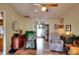 Open living room with hardwood floors, ceiling fan, comfortable seating, and natural light at 2465 Planters Cove Cir, Lawrenceville, GA 30044