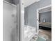 A bathroom features a soaking tub and separate shower, offering a spa-like experience and convenience at 5640 Rolling Oaks Dr, Cumming, GA 30040