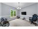 Bedroom features a window view, carpeted floor, and space for a relaxing retreat at 5640 Rolling Oaks Dr, Cumming, GA 30040