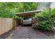 This home has a one-car carport for covered parking in a wooded setting, as well as a privacy fence for added security at 5640 Rolling Oaks Dr, Cumming, GA 30040