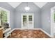 Bright dining area features tall windows and unique tiled flooring at 5640 Rolling Oaks Dr, Cumming, GA 30040
