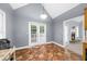Open dining area offers tiled floors and french doors with backyard view at 5640 Rolling Oaks Dr, Cumming, GA 30040