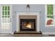 A close-up of a fireplace, complete with a mantel and adjacent doorway at 5640 Rolling Oaks Dr, Cumming, GA 30040