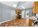 Spacious kitchen with stainless appliances, tile floor, and a view into other rooms at 5640 Rolling Oaks Dr, Cumming, GA 30040