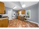 Traditional kitchen with stainless appliances, tile backsplash, and unique patterned flooring at 5640 Rolling Oaks Dr, Cumming, GA 30040