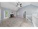 Spacious living room with a fireplace, vaulted ceiling, and access to the backyard at 5640 Rolling Oaks Dr, Cumming, GA 30040