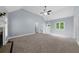 Another angle of the spacious living room, showcasing the fireplace, and stairs at 5640 Rolling Oaks Dr, Cumming, GA 30040