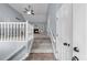 Bright, open living room featuring a vaulted ceiling, ceiling fan, and a cozy fireplace at 5640 Rolling Oaks Dr, Cumming, GA 30040