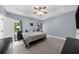 The main bedroom boasts neutral carpet, light gray walls, and tray ceilings, creating a refined and spacious retreat at 5640 Rolling Oaks Dr, Cumming, GA 30040