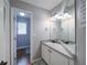Bathroom featuring a granite vanity, wood look floors, and a view of the toilet and shower at 4645 Waterford Dr, Suwanee, GA 30024