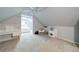 Bonus room featuring a desk, a daybed, carpet, ceiling fan, and access to an additional room at 4645 Waterford Dr, Suwanee, GA 30024