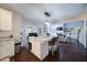 Spacious kitchen with granite counters, island seating, and a seamless view to the living room area at 4645 Waterford Dr, Suwanee, GA 30024