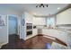 Featuring a stainless steel dishwasher, oven, microwave, white cabinets, and granite countertops at 4645 Waterford Dr, Suwanee, GA 30024