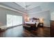 Spacious main bedroom features a trey ceiling, a large window and hardwood floors at 4645 Waterford Dr, Suwanee, GA 30024