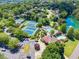 Aerial view of community amenities featuring tennis courts, a swimming pool, and beautifully landscaped grounds at 7045 Grand View Way, Suwanee, GA 30024