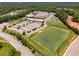 Aerial view of school buildings with athletic fields, tennis courts, and parking lots at 7045 Grand View Way, Suwanee, GA 30024
