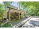 Spacious wooden backyard deck with both covered and uncovered seating areas. Great for entertaining and enjoying the outdoors at 7045 Grand View Way, Suwanee, GA 30024