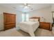 Cozy bedroom featuring classic wooden furniture and a neutral color scheme at 7045 Grand View Way, Suwanee, GA 30024