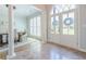 Spacious foyer with marble flooring, columns, and a view into the dining room at 7045 Grand View Way, Suwanee, GA 30024