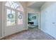 Elegant foyer featuring double doors, marble flooring, and a view into the office at 7045 Grand View Way, Suwanee, GA 30024