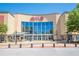 Exterior of an AMC movie theater with a large glass facade and ticket booths at 7045 Grand View Way, Suwanee, GA 30024