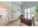 Bright home office featuring ample natural light, a classic desk and a comfortable seating area at 7045 Grand View Way, Suwanee, GA 30024