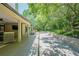 Extensive backyard outdoor area with patio, deck, and stone work along backyard at 7045 Grand View Way, Suwanee, GA 30024