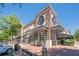 Attractive retail building facade with brick accents and sidewalk seating at 7045 Grand View Way, Suwanee, GA 30024
