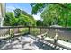 A relaxing back porch with seating and views of the lush backyard at 1357 Railroad Ave, Sugar Hill, GA 30518