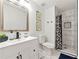 Modern bathroom features a sleek vanity, updated fixtures, and a stylish tiled shower at 1357 Railroad Ave, Sugar Hill, GA 30518