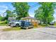Rear exterior of home shows ample parking and yard space with privacy fence at 1357 Railroad Ave, Sugar Hill, GA 30518