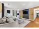 Inviting living room features a modern accent wall, neutral colors, and stylish decor at 1357 Railroad Ave, Sugar Hill, GA 30518