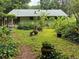 Lush backyard with mature trees, plants, and a green house at 3291 Shady Oak Dr, Atlanta, GA 30340