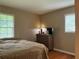 Cozy bedroom featuring hardwood floors and natural light from windows at 3291 Shady Oak Dr, Atlanta, GA 30340