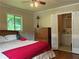 Comfortable bedroom featuring hardwood floors and access to an ensuite bathroom at 3291 Shady Oak Dr, Atlanta, GA 30340