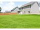 Expansive backyard showcasing lush, green lawn and a full fence; perfect for outdoor enjoyment at 3855 Saddle Bag Ct, Dacula, GA 30019