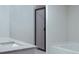 Bright bathroom with marble counter and glass shower door at 3855 Saddle Bag Ct, Dacula, GA 30019