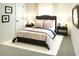 Comfortable main bedroom featuring a cozy bed, side tables and decorations at 3855 Saddle Bag Ct, Dacula, GA 30019