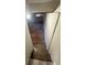 Stairway leading down to the basement reveals the basement's ample space and a source of natural light at 4510 Burks Rd, Forest Park, GA 30297